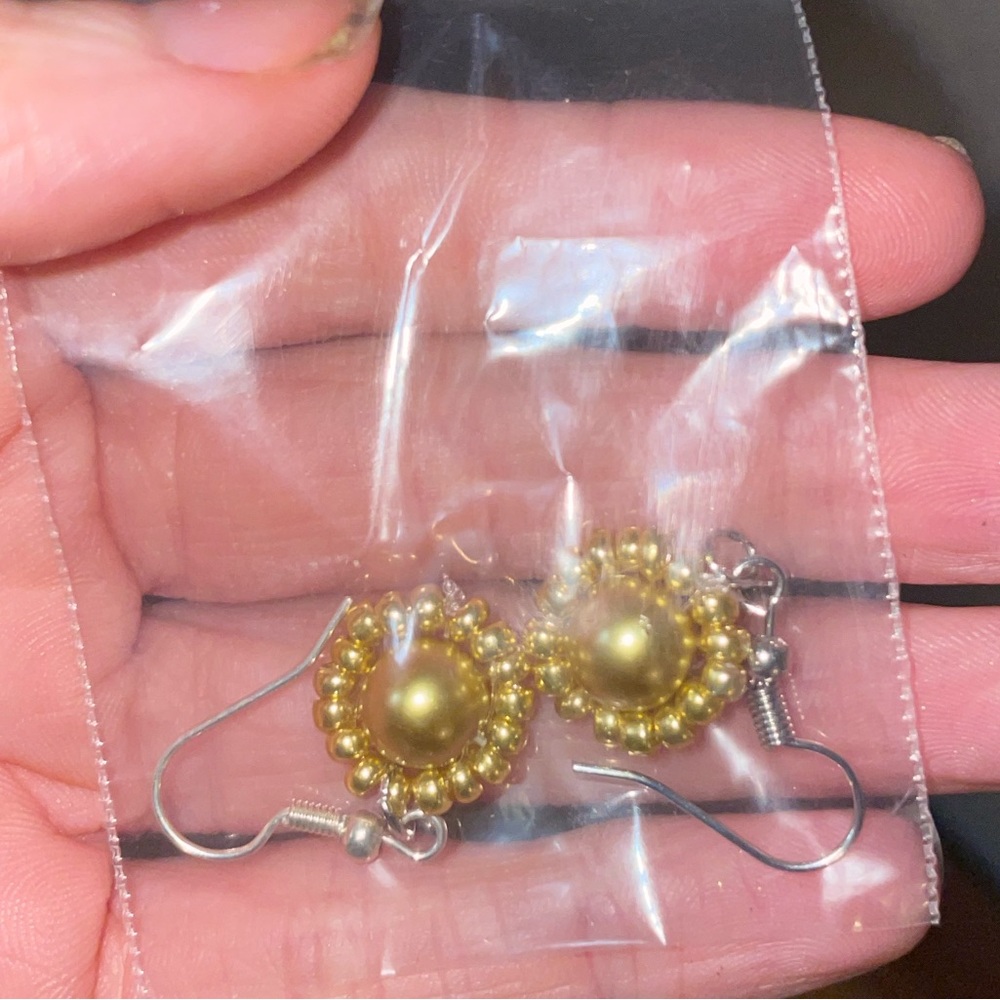 Golden beaded earrings and bracelets sold together